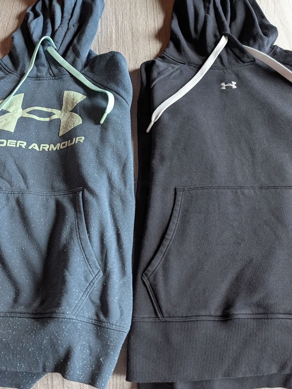 Under Armour Ladies Black & Heathered Dark Gray Hoodies with Logo, Size Medium.
